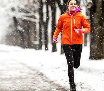 Woman running outside during the winter