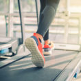 Closeup of feet walking on a treadmill