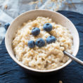 Bowl of oatmeal topped with blueberries