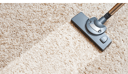 Vacuum cleaner moving on carpet