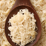 Spoon sitting in sauerkraut