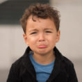 Sad looking young child with lips pouted
