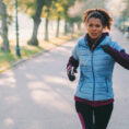 Person running outside in a park in spring weather
