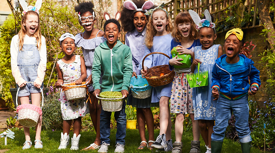 Group of children wearing Easter clothes and holding Easter baskets Group of children wearing Easter clothes and holding Easter baskets