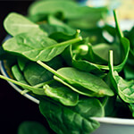 Bowl of fresh spinach leaves Bowl of fresh spinach leaves