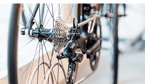 Closeup of a bicycle wheel and gears