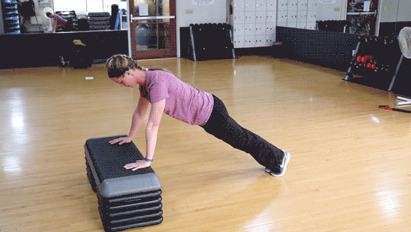 Person performing the Incline Push-Up exercise