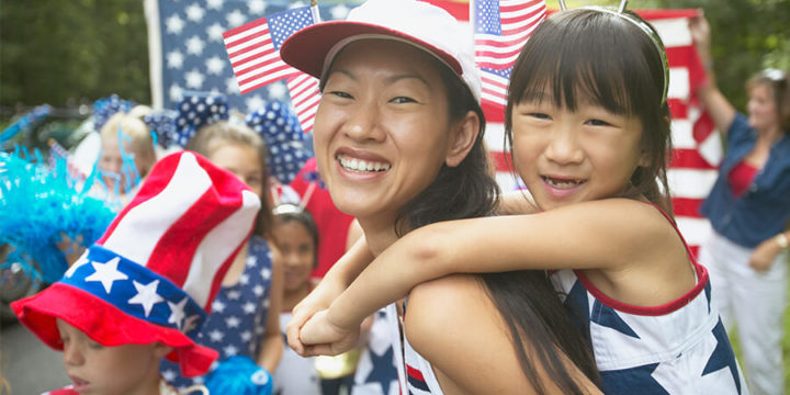 Mother and daughter wearing red, white and blue at a July Fourth celebration parade