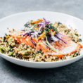 Bowl with grains topped with a filet of salmon