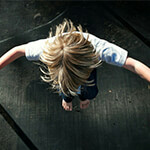 Young child jumping on indoor trampoline