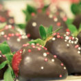 Chocolate covered strawberries on plate