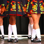 Closeup of legs and feet of several Irish step dancers