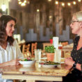 Woman talking to dietitian in restaurant