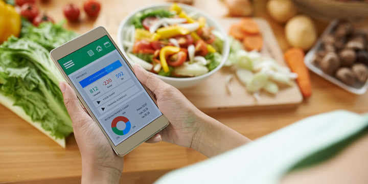 Person using smart phone app to track food and look at nutritional values