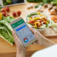 Person using smart phone app to track food and look at nutritional values