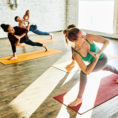 Group of people practicing yoga in studio