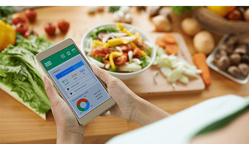 Person tracking food consumption and nutritional values on smart phone app