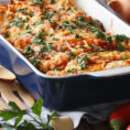 Casserole dish full of chicken enchiladas
