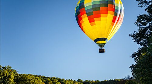 Hot Air Balloon Ride in Fall Landscape