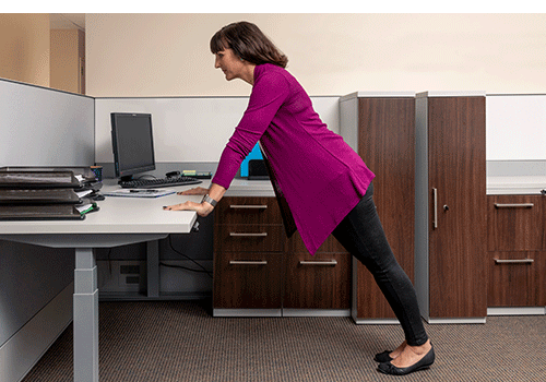 Woman performing Desk Exercise Modified Push Up