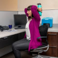 Woman performing exercise at desk