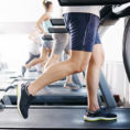 Gym with many people running on treadmills