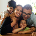 Family hugging each other and smiling