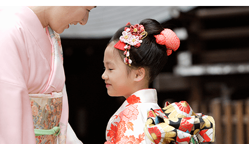 Mother and child smiling in kimonos