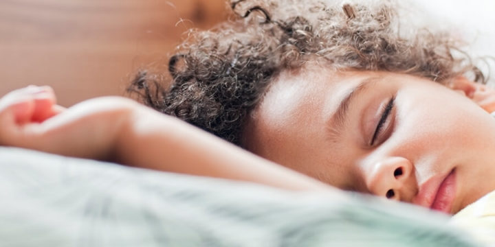 Child asleep in bed