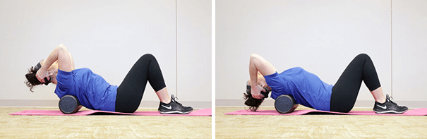 Woman stretching with floor thoracic extension with foam roller