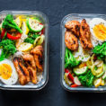 Two glass containers with healthy meals