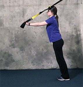 Person performing Rollout to Triceps Press TRX Exercise
