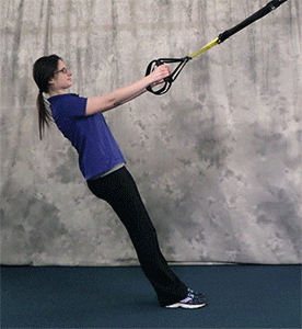 Person performing Row to Arm Curl TRX Exercise