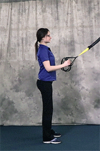 Person performing Squat to Y TRX Exercise