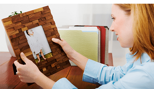 Mom Holding Picture of Baby at Work