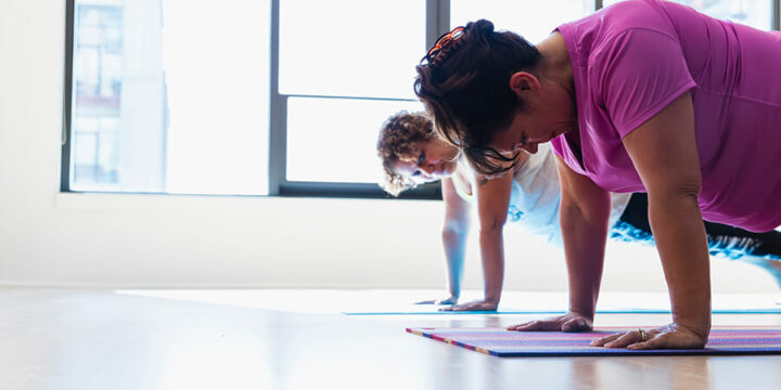 Two people performing push-ups for exercise