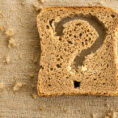Piece of bread with a question mark cut out of it