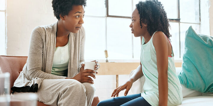 Mother having a serious conversation with child