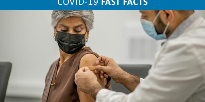 Person being vaccinated with face mask on