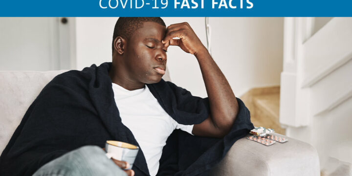 Man with eyes closed and hand to forehead with a headache