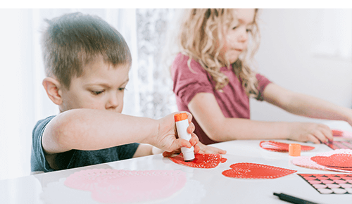 Children doing valentine's day arts and crafts