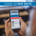 Mobile phone displaying COVID-19 news