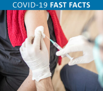 Person receiving COVID-19 booster vaccine shot