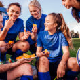 Athletes eating on field