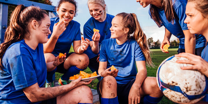 Athletes eating on field