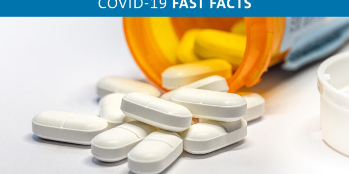 Oval white pills and pill bottle