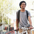 college student mounting bike on way to class