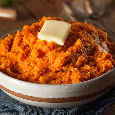 Close up of sweet potatoes in a serving bowl