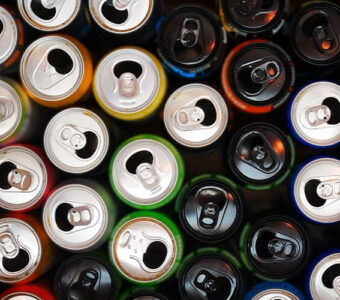 Variety of open cans of energy drinks