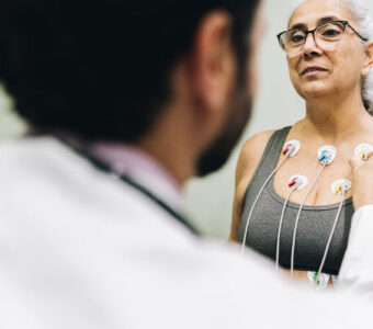 Patient talking with their doctor during a cardiopulmonary stress test on a hospital
